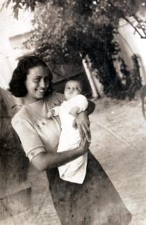 Judita Sendrei holding a baby